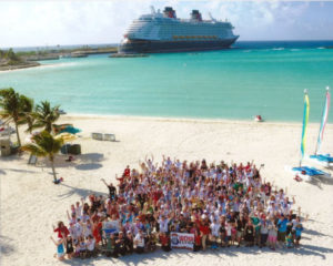 Walt Disney World Radio crew on a sandy beach
