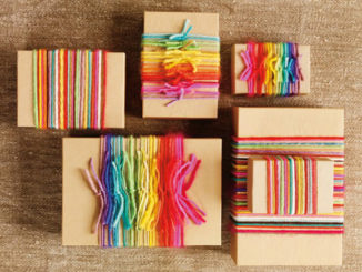 gifts wrapped in rainbow yarn