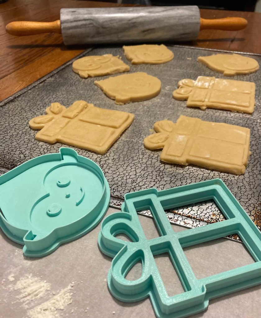elfster cookie cutters on cookie sheet