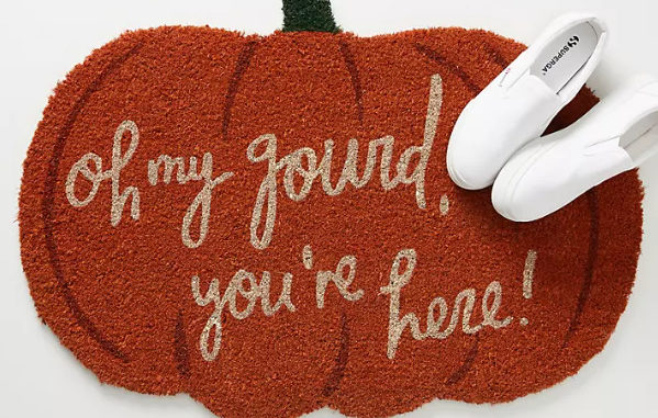 Oh My Gourd doormat on pumpkin background