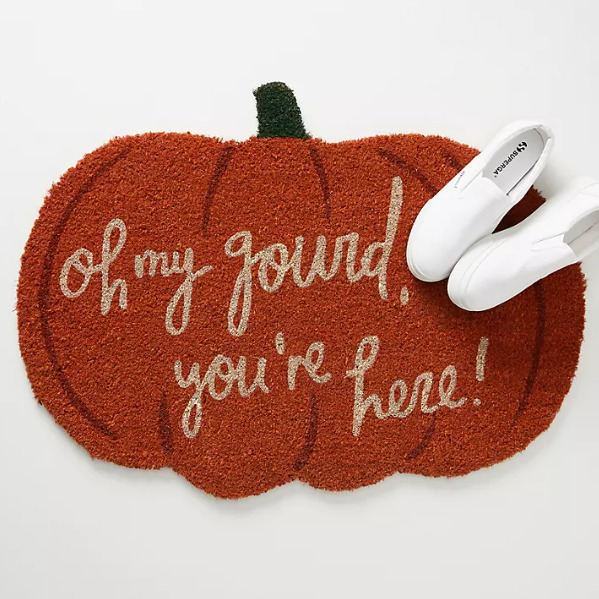 Oh My Gourd, You're Here written on pumpkin doormat