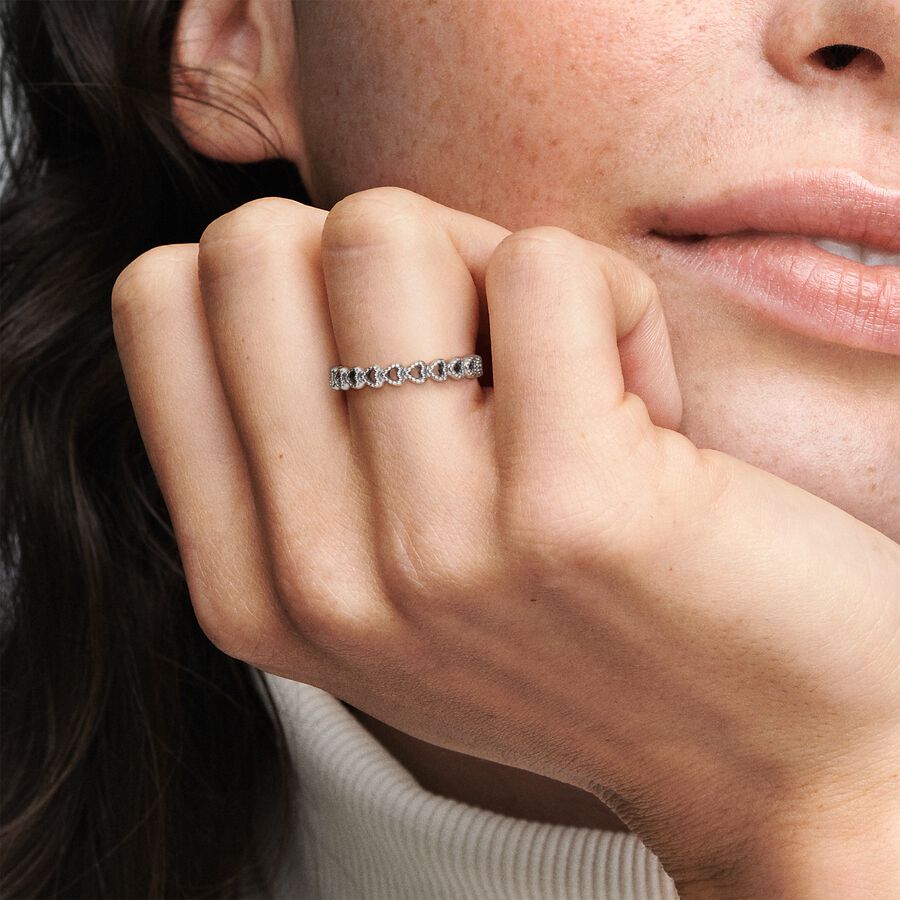 Woman wearing Band of Hearts ring from Pandora