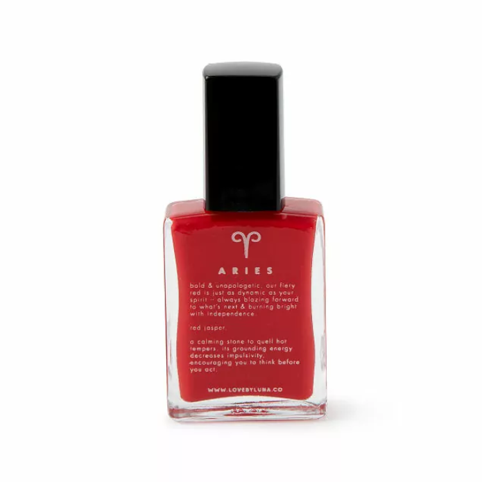 Red nail polish in a bottle for Aries gift listing traits of the zodiac sign
