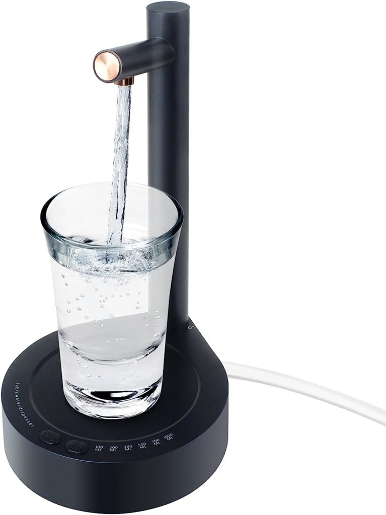 Desktop water dispenser filling glass of water