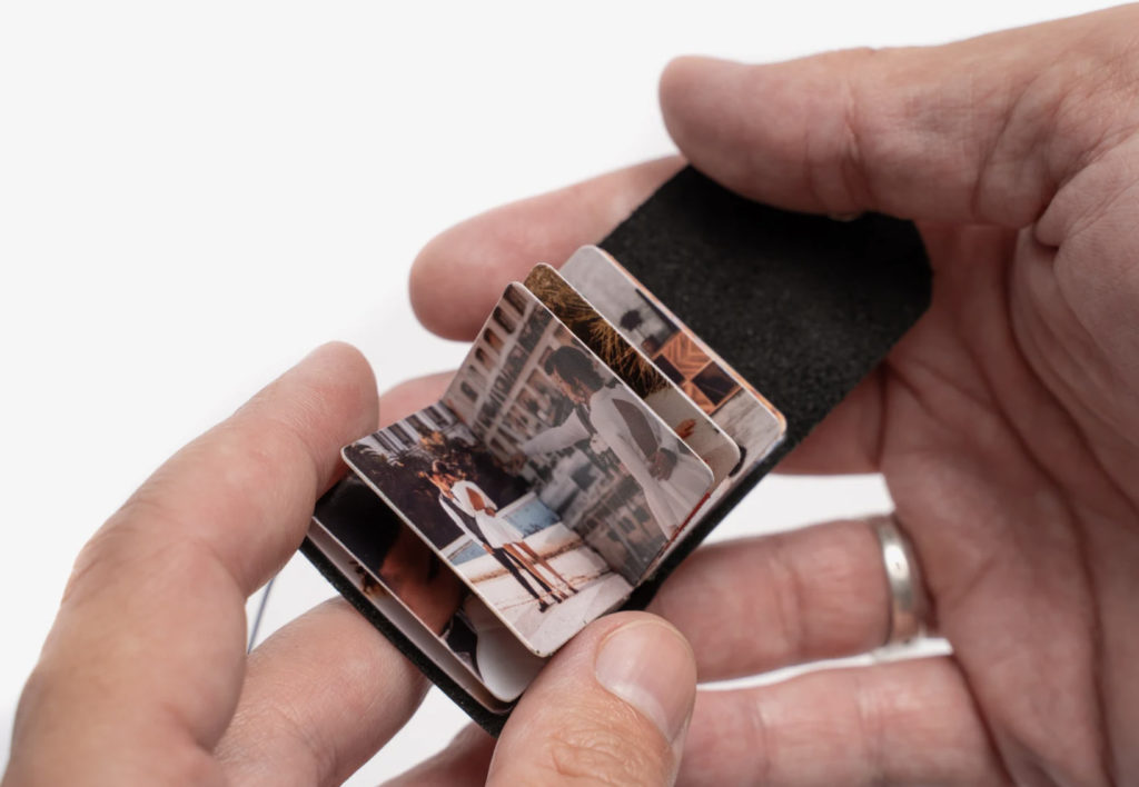 A mini photo album keychain makes a great sentimental present for dads or grads