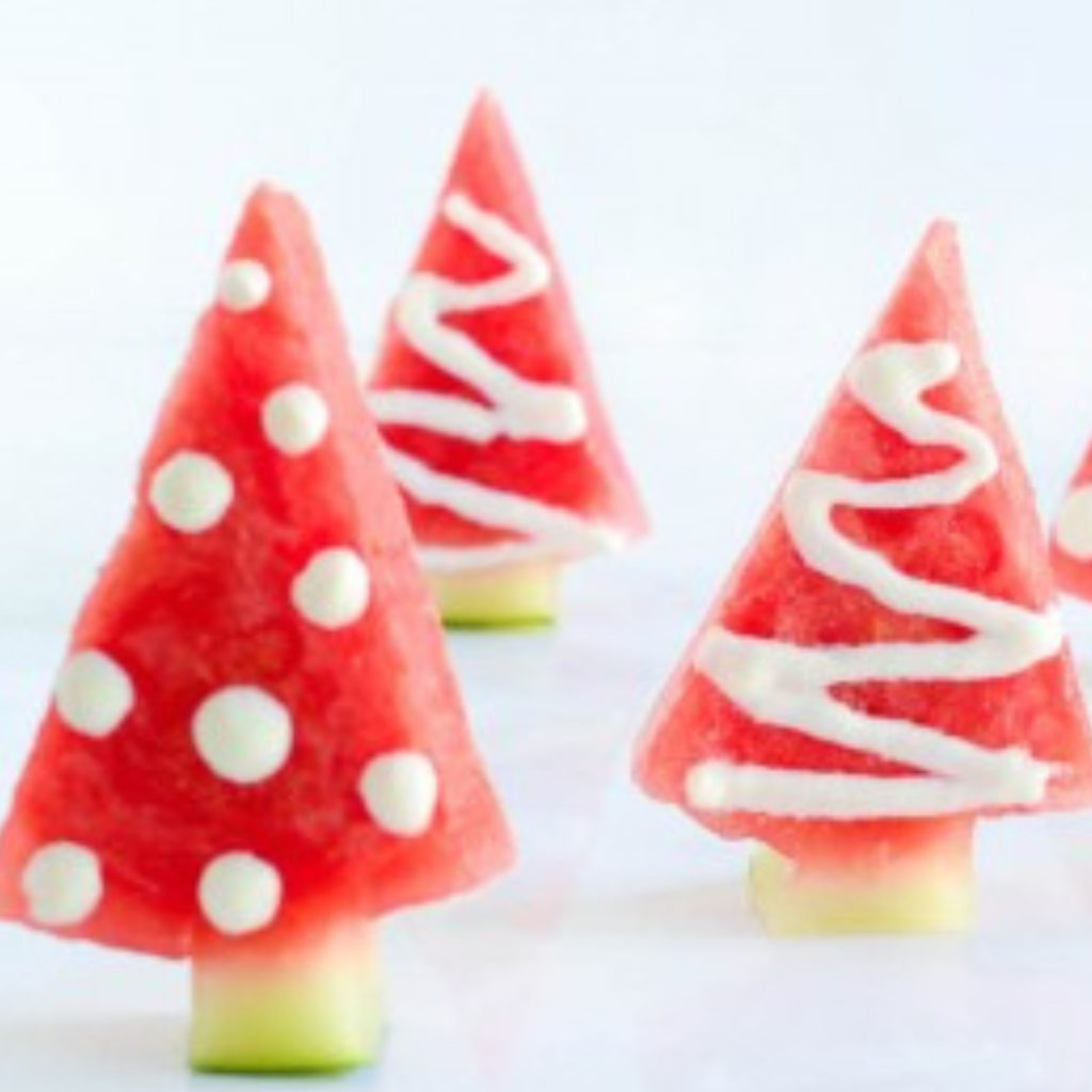 Watermelon cut into Christmas Tree shapes for Christmas in July