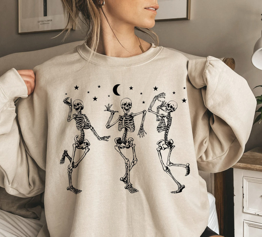 Sweatshirt with skeletons dancing in the moonlight