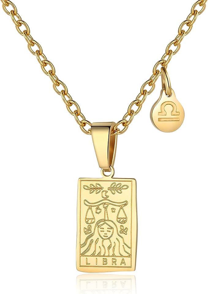 Gold necklace with Libra scales